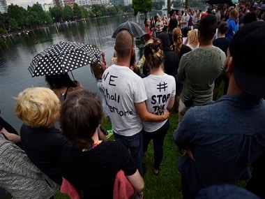 After the Orlando nightclub shooting, mourners gather at the site. AP