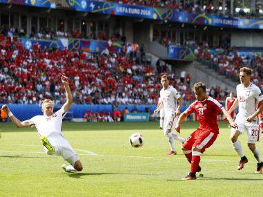 Switzerland’s Xherdan Shaqiri in action with Poland’s Kamil Glik. Reuters