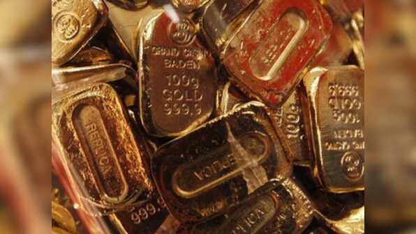 Gold futures fall by Rs 353 to Rs 41,853 per 10 gram on weak global cues as participants cut down positions