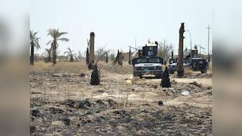 Iraqi forces unearth mass grave in IS stronghold Fallujah with over 400 bodies