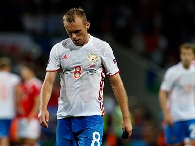 Russia's Denis Glushakov leaves the pitch after his team's defeat to Wales. AP