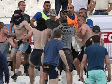 Stewards calm Russian supporters after clashes broke out in the stands during Euro 2016. AP
