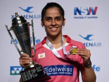 Saina Nehwal poses with the winner’s trophy after defeating China’s Sun Yu in the final at the Australian Open. AFP
