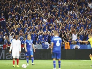 Iceland supporters cheer during the Euro 2016 round of 16 soccer match against England. AP