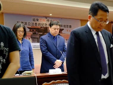 Chinese dissident Wuer Kaixi (2nd R), Taiwan lawmakers and a human rights activist pay their respects at the Parliament in Taipei on the eve of the 27th anniversary of the crackdown on pro-democracy protests at Beijing's Tiananmen Square. AFP