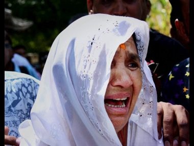 Relative of an accused of Gulbarg society case, crying during pronouncement of verdict at a court in Ahmedabad on Monday. PTI