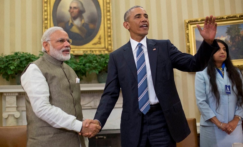 Barack Obama and Prime Minister India Narendra Modi shake hands in the Oval Office of the White House on Tuesday. PTI