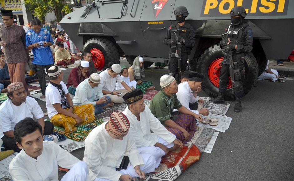 A group of Indonesian Muslims offers morning prayers under heavy police guard during Eid al-Fitr on the grounds of the Hati Kudus Jesus church in Malang, East Java as a show of solitarity and tolerance to the Christian faith. Indonesian Muslims are celebrating Eid with festivities and family reunions in the world's most populous Muslim-majority country at the end of the holy month of Ramadan. AFP A group of Indonesian Muslims offers morning prayers under heavy police guard during Eid al-Fitr on the grounds of the Hati Kudus Jesus church in Malang, East Java as a show of solitarity and tolerance to the Christian faith. Indonesian Muslims are celebrating Eid with festivities and family reunions in the world's most populous Muslim-majority country at the end of the holy month of Ramadan. AFP
