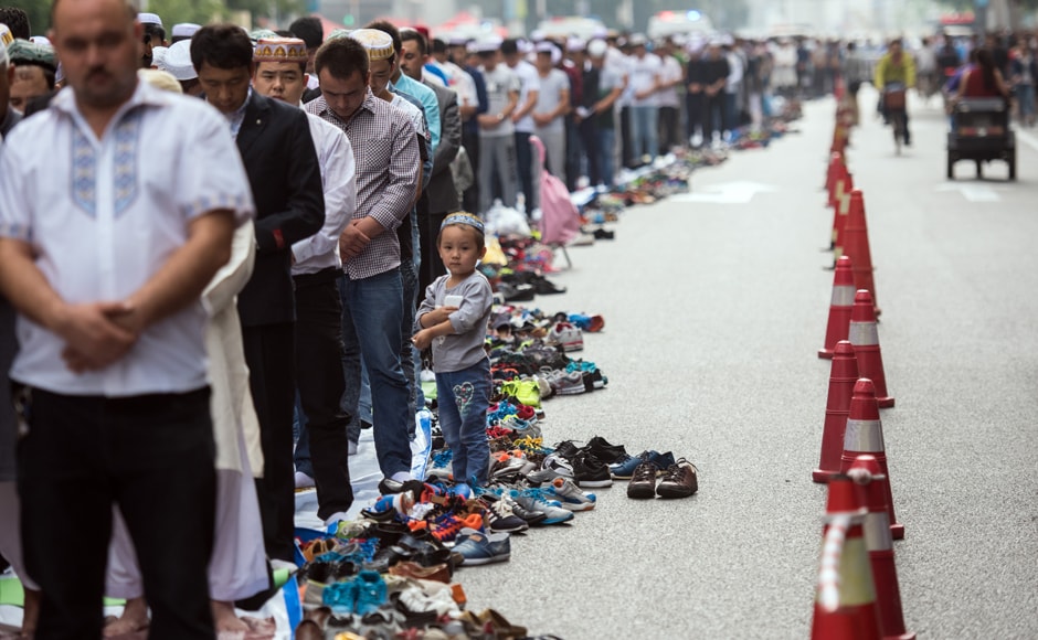 Chinese Muslims perform congregational Eid morning prayers on the streets near the Huxi mosque during the sacrificial Eid al-Adha festival in Shanghai . AFP Chinese Muslims perform congregational Eid morning prayers on the streets near the Huxi mosque during the sacrificial Eid al-Adha festival in Shanghai . AFP