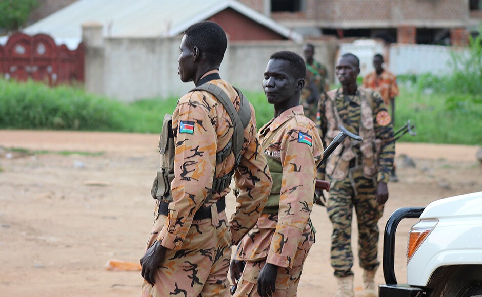 South Sudanese policemen and soldiers stand guard along a street following renewed fighting in South Sudan's capital Juba. A ceasefire in Juba appeared to hold for a second straight day Wednesday after intense fighting that killed hundreds of people and forced tens of thousands to flee their homes. Reuters South Sudanese policemen and soldiers stand guard along a street following renewed fighting in South Sudan's capital Juba. A ceasefire in Juba appeared to hold for a second straight day Wednesday after intense fighting that killed hundreds of people and forced tens of thousands to flee their homes. Reuters