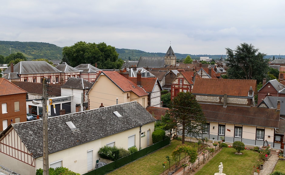 General view of the town of Saint-Etienne-du-Rouvray, Normandy, France, where a 84-year-old priest was murdered in a church, in background, during an attack, Tuesday, July 26, 2016. Two attackers invaded a church Tuesday during morning Mass near the Normandy city of Rouen, killing an 84-year-old priest by slitting his throat and taking hostages before being shot and killed by police, French officials said. (AP Photo/Francois Mori) General view of the town of Saint-Etienne-du-Rouvray, Normandy, France, where a 84-year-old priest was murdered in a church, in background, during an attack, Tuesday, July 26, 2016. Two attackers invaded a church Tuesday during morning Mass near the Normandy city of Rouen, killing an 84-year-old priest by slitting his throat and taking hostages before being shot and killed by police, French officials said. (AP Photo/Francois Mori)
