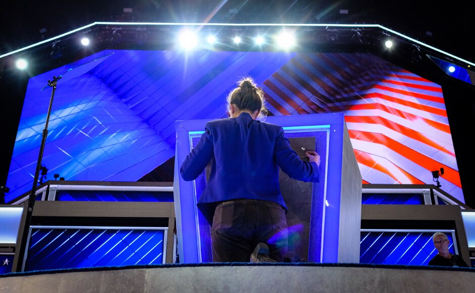 Final touches are made to the podium Sunday evening. US President Barack Obama will speak on Wednesday night. Other high-profile speakers include former President Bill Clinton and Vice President Joe Biden. AP Final touches are made to the podium Sunday evening. US President Barack Obama will speak on Wednesday night. Other high-profile speakers include former President Bill Clinton and Vice President Joe Biden. AP