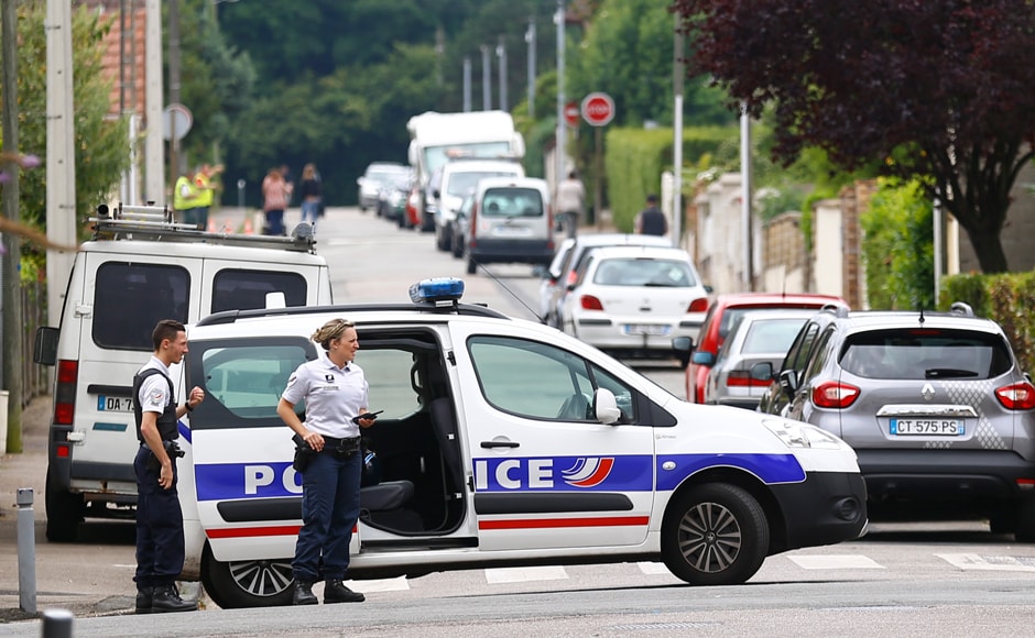 French police officers prevent the access to the scene of an attack in Saint Etienne du Rouvray, Normandy, France, Tuesday, 26 July, 2016. Two attackers invaded a church Tuesday during morning Mass near the Normandy city of Rouen, killing an 84-year-old priest by slitting his throat and taking hostages before being shot and killed by police, French officials said. AP/Francois Mori French police officers prevent the access to the scene of an attack in Saint Etienne du Rouvray, Normandy, France, Tuesday, 26 July, 2016. Two attackers invaded a church Tuesday during morning Mass near the Normandy city of Rouen, killing an 84-year-old priest by slitting his throat and taking hostages before being shot and killed by police, French officials said. AP/Francois Mori