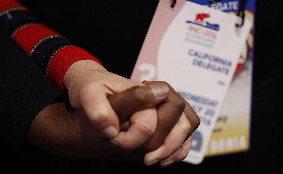 Delegates hold hands as they pray during the invocation in the midst of the third session. Race has been a touch poll plank for Trump, ever since he announced in his first speech last year that most illegal Mexican immigrants are rapists. Protesters from the Black Lives Matter movement demonstrated outside the convention. Reuters Delegates hold hands as they pray during the invocation in the midst of the third session. Race has been a touch poll plank for Trump, ever since he announced in his first speech last year that most illegal Mexican immigrants are rapists. Protesters from the Black Lives Matter movement demonstrated outside the convention. Reuters