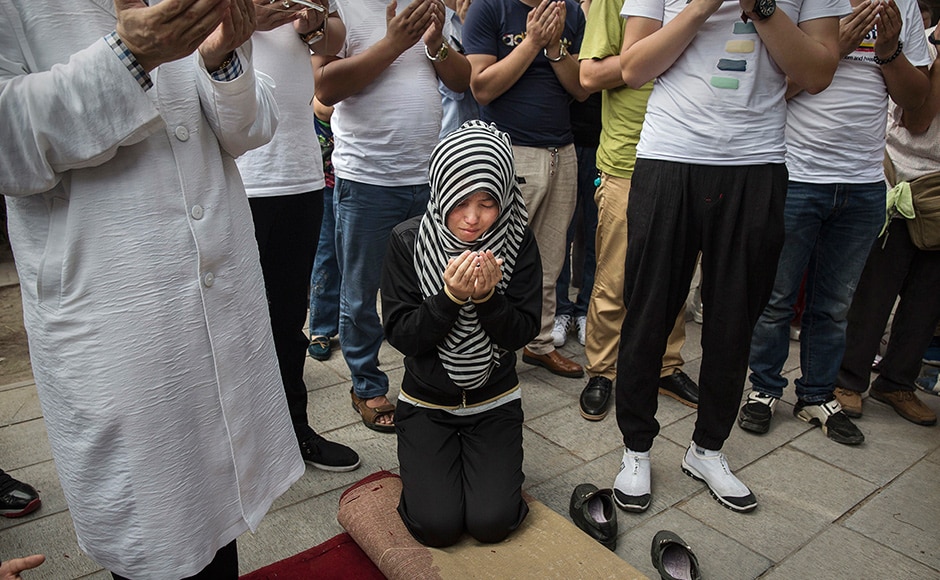 A Chinese Hui Muslim woman weeps as she prays at the 'Sheiks Tombs' after Eid prayers. The Hui, one of 55 ethnic minorities in China (along with the Han majority), have long nurtured a coexistence with the Communist Party and is among the minority groups with political representation at various levels of government. Getty images A Chinese Hui Muslim woman weeps as she prays at the 'Sheiks Tombs' after Eid prayers. The Hui, one of 55 ethnic minorities in China (along with the Han majority), have long nurtured a coexistence with the Communist Party and is among the minority groups with political representation at various levels of government. Getty images
