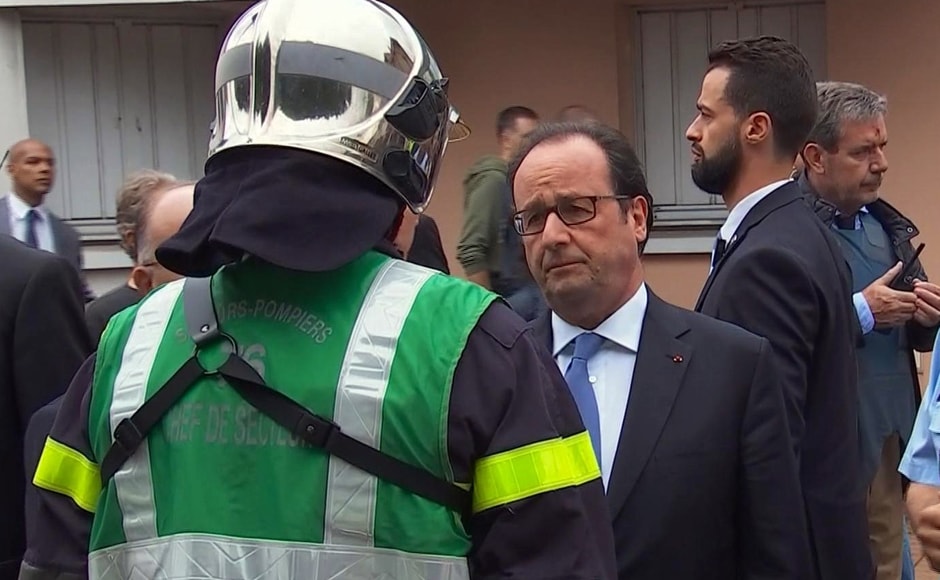 In this grab made from video, French President Francois Hollande speaks with emergency services personnel after arriving at the scene of the hostage situation in Normandy, France, Tuesday, 26 July, 2016. Two attackers took hostages inside a French church during morning Mass on Tuesday in the Normandy town of Saint-Etienne-du-Rouvray, killing an 86-year-old priest by slitting his throat before being shot and killed by police, French officials said. The Islamic State group claimed responsibility for the attack. AP In this grab made from video, French President Francois Hollande speaks with emergency services personnel after arriving at the scene of the hostage situation in Normandy, France, Tuesday, 26 July, 2016. Two attackers took hostages inside a French church during morning Mass on Tuesday in the Normandy town of Saint-Etienne-du-Rouvray, killing an 86-year-old priest by slitting his throat before being shot and killed by police, French officials said. The Islamic State group claimed responsibility for the attack. AP
