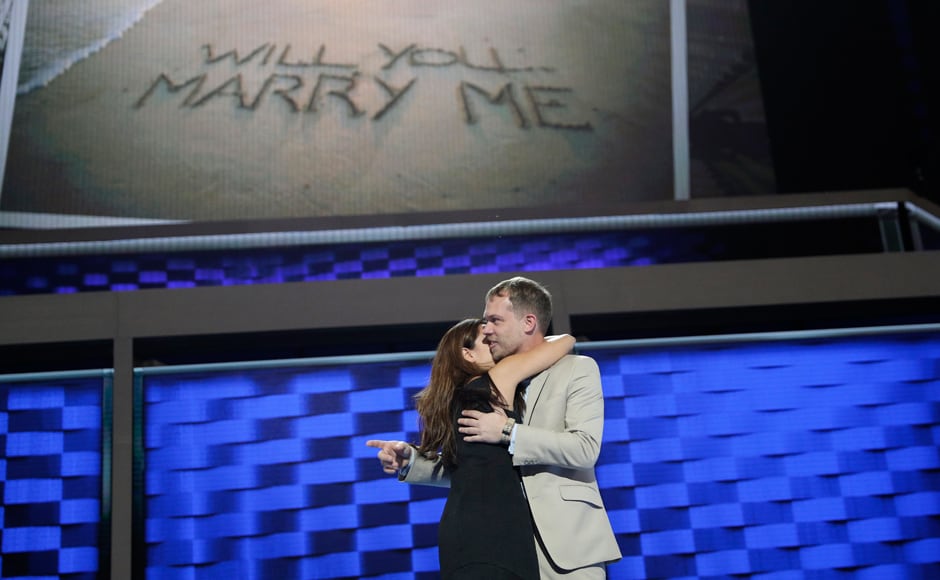Andrew Binns, right, embraces Liz Hart after the two got engaged on the main stage before the DNC. Both of them work on production for the convention. AP Andrew Binns, right, embraces Liz Hart after the two got engaged on the main stage before the DNC. Both of them work on production for the convention. AP