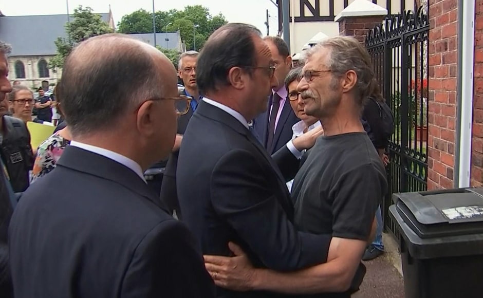 In this grab made from video, French President Francois Hollande, center, and Interior Minister Bernard Cazeneuve speaks with a local man after arriving at the scene of the hostage situation in Normandy, France, Tuesday, 26 July, 2016. Two attackers took hostages inside a French church during morning Mass on Tuesday in the Normandy town of Saint-Etienne-du-Rouvray, killing an 86-year-old priest by slitting his throat before being shot and killed by police, French officials said. The Islamic State group claimed responsibility for the attack. AP In this grab made from video, French President Francois Hollande, center, and Interior Minister Bernard Cazeneuve speaks with a local man after arriving at the scene of the hostage situation in Normandy, France, Tuesday, 26 July, 2016. Two attackers took hostages inside a French church during morning Mass on Tuesday in the Normandy town of Saint-Etienne-du-Rouvray, killing an 86-year-old priest by slitting his throat before being shot and killed by police, French officials said. The Islamic State group claimed responsibility for the attack. AP