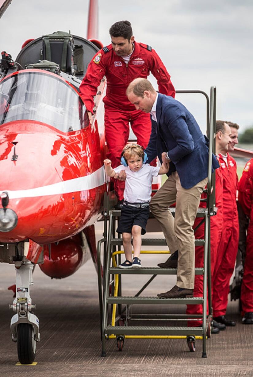 'But i want to stay in that red aircraft dad!' Prince Geroge's thoughts. Photo by WPA Pool / Pool