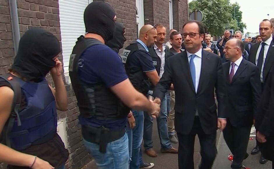 In this grab made from video, French President Francois Hollande shakes hands with police and security services personnel after arriving at the scene of the hostage situation in Saint-Etienne-du-Rouvray Normandy, France, Tuesday, 26 July, 2016. Two attackers took hostages inside a French church during morning Mass on Tuesday near the city of Rouen, killing an 86-year-old priest by slitting his throat before being shot and killed by police, French officials said. The Islamic State group claimed responsibility for the attack. AP In this grab made from video, French President Francois Hollande shakes hands with police and security services personnel after arriving at the scene of the hostage situation in Saint-Etienne-du-Rouvray Normandy, France, Tuesday, 26 July, 2016. Two attackers took hostages inside a French church during morning Mass on Tuesday near the city of Rouen, killing an 86-year-old priest by slitting his throat before being shot and killed by police, French officials said. The Islamic State group claimed responsibility for the attack. AP
