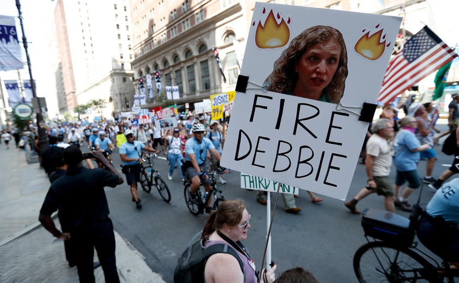Sanders' supporters hold up a sign call calling for Debbie Wasserman Schultz, chairwoman of the Democratic National Committee to be fired. Schultz later stepped down. AP Sanders' supporters hold up a sign call calling for Debbie Wasserman Schultz, chairwoman of the Democratic National Committee to be fired. Schultz later stepped down. AP
