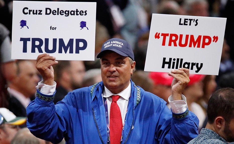 A delegate holds a sign calling for Ted Cruz delegates to support Donald Trump in order to defeat Hillary Clinton. The most popular memorabilia on sale in Cleveland were those targeting Clinton. A delegate holds a sign calling for Ted Cruz delegates to support Donald Trump in order to defeat Hillary Clinton. The most popular memorabilia on sale in Cleveland were those targeting Clinton.