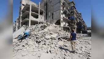 Syrian army advances in east Aleppo, thousands of civilians flee battered city