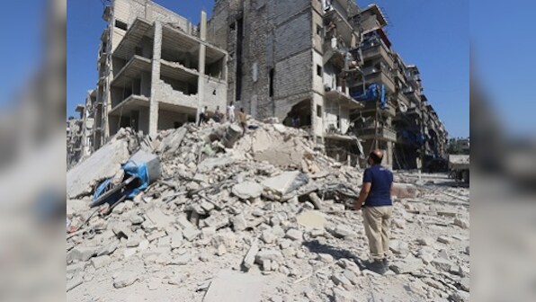 Syrian army advances in east Aleppo, thousands of civilians flee battered city