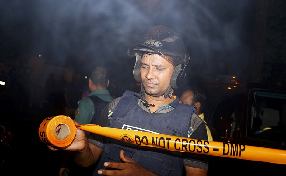 Bangladeshi security personnels cordon off the area after a group of as many as nine gunmen attacked a restaurant popular with foreigners in a diplomatic zone of Dhaka, Bangladesh on Saturday. Gunshots and sounds of explosion started to rock the area at 7:40 AM (local time) as security forces launched an offensive to end the 11-hour-long hostage crisis at a cafe in Dhaka's diplomatic zone Gulshan. AP Bangladeshi security personnels cordon off the area after a group of as many as nine gunmen attacked a restaurant popular with foreigners in a diplomatic zone of Dhaka, Bangladesh on Saturday. Gunshots and sounds of explosion started to rock the area at 7:40 AM (local time) as security forces launched an offensive to end the 11-hour-long hostage crisis at a cafe in Dhaka's diplomatic zone Gulshan. AP