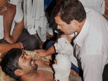 Rahul Gandhi meeting the victims. PTI