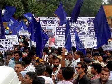 Members of Dalit Community protest in Ahmedabad on Tuesday against the assault on Dalit members by cow protectors in Rajkot. PTI