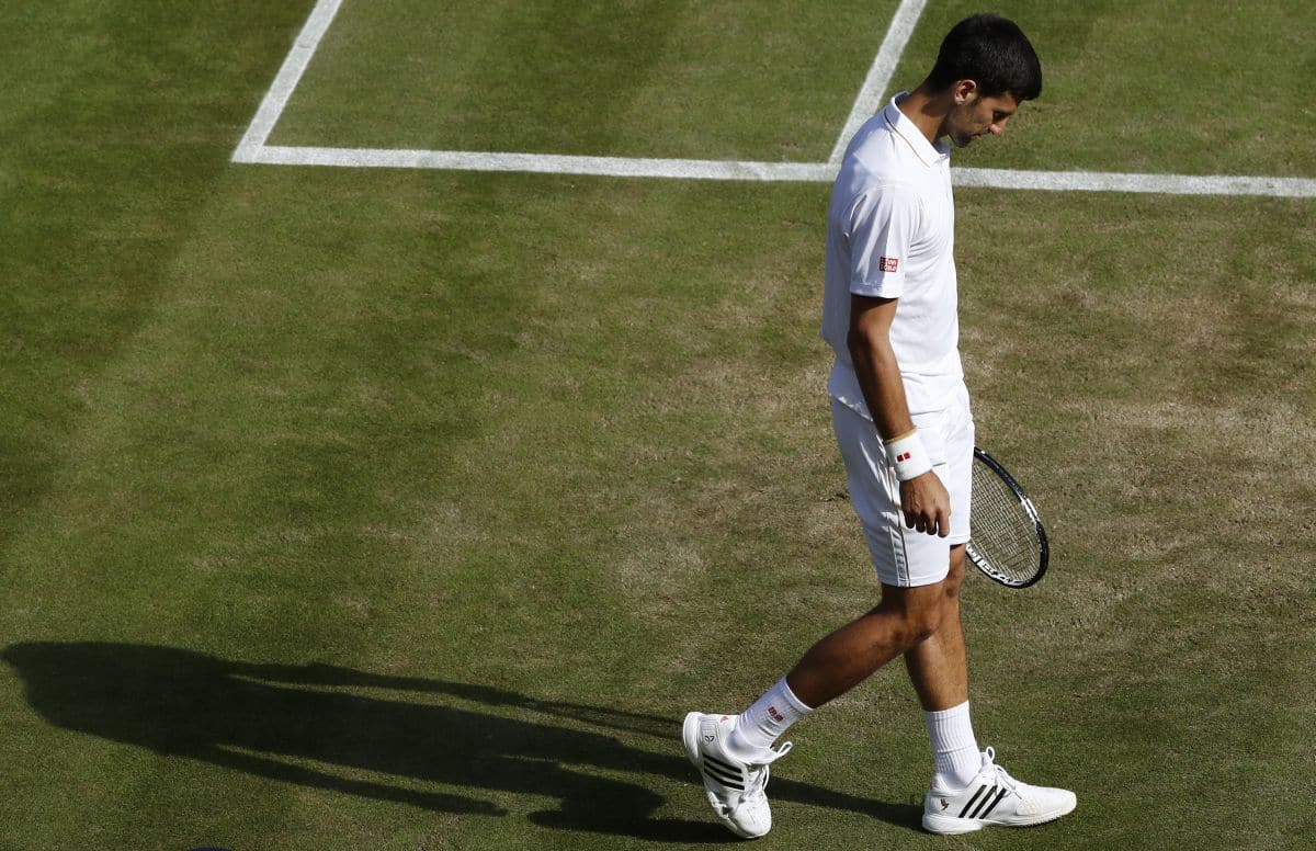 Britain Tennis - Wimbledon - All England Lawn Tennis & Croquet Club, Wimbledon, England - 2/7/16 Serbia's Novak Djokovic reacts after losing his match against USA's Sam Querrey REUTERS/Stefan Wermuth - RTX2JDXS