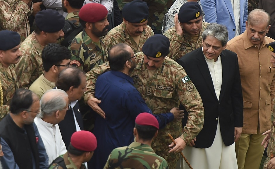 Pakistan Military Chief Raheel Sharif hugs Faisal Edhi, son of Abdul Sattar Edhi, during the funeral. Edhi donated his eyes and asked his family to bury him in the clothes he wore at the time of his death, his son Faisal Eidhi said. As part of his commitment to living simply, Edhi would never own more than a few items of clothing and a pair of shoes, his son said. Later in the day, Edhi was buried in the graveyard he established on the city's outskirts for unclaimed bodies. AFP Pakistan Military Chief Raheel Sharif hugs Faisal Edhi, son of Abdul Sattar Edhi, during the funeral. Edhi donated his eyes and asked his family to bury him in the clothes he wore at the time of his death, his son Faisal Eidhi said. As part of his commitment to living simply, Edhi would never own more than a few items of clothing and a pair of shoes, his son said. Later in the day, Edhi was buried in the graveyard he established on the city's outskirts for unclaimed bodies. AFP