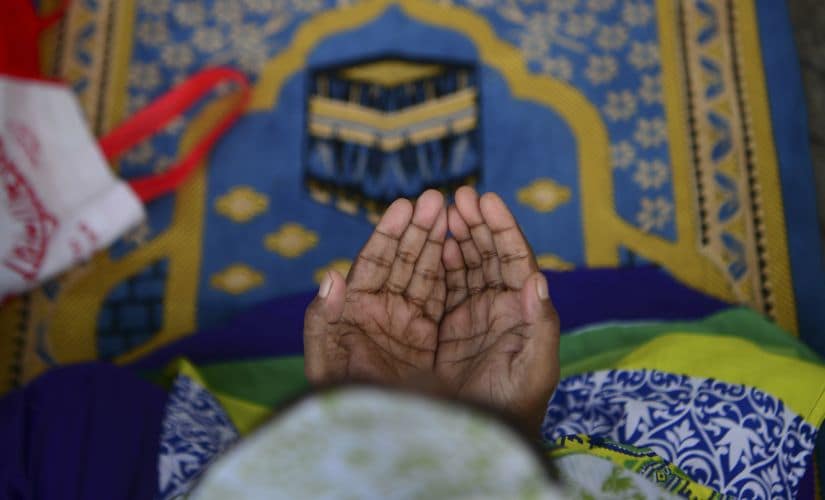 A woman prays at during Eid-ul-fitr in Dhaka on Thursday. AFP