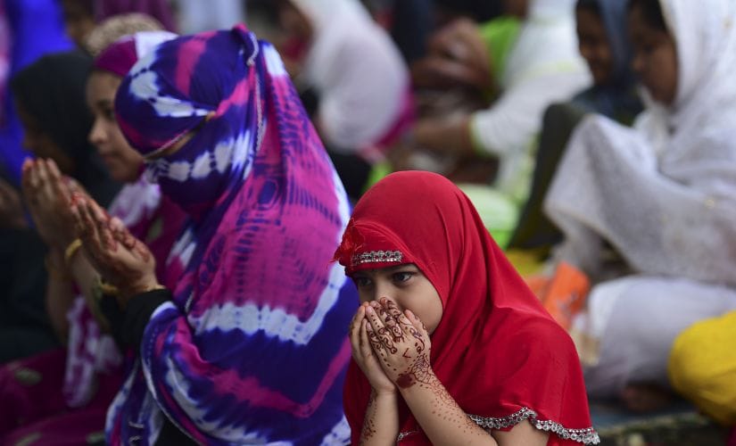 People gathered to pray on the eve of Eid in Dhaka. AFP