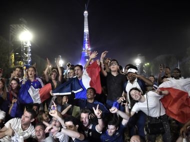France's supporters celebrate in front of the Eiffel Tower. AFP