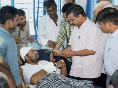 Delhi CM Arvind Kejriwal along with AAP volunteers visiting the Dalit member who consumed poison in protest against assault on Dalit members by cow protectors few days back, at a hospital in Rajkot on Friday. PTI