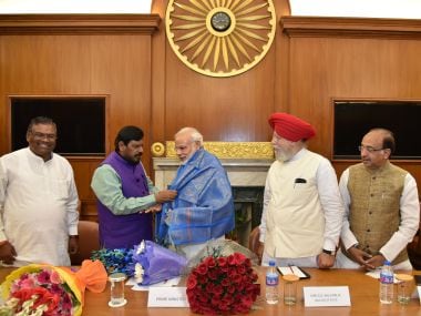 Prime Minister Narendra Modi with his newly-inducted cabinet of ministers. PIB