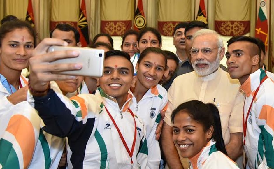 The Indian women's hockey team, national badminton coach Pullela Gopichand and boxing coach Gurbax Singh Sandhu were also present. However, some Rio-qualified athletes gave the function a miss as they are currently training abroad. Photo: PIB/Twitter The Indian women's hockey team, national badminton coach Pullela Gopichand and boxing coach Gurbax Singh Sandhu were also present. However, some Rio-qualified athletes gave the function a miss as they are currently training abroad. Photo: PIB/Twitter