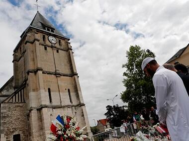Muslim worshippers offer prayer at a church in Normandy, where a priest was killed. AP
