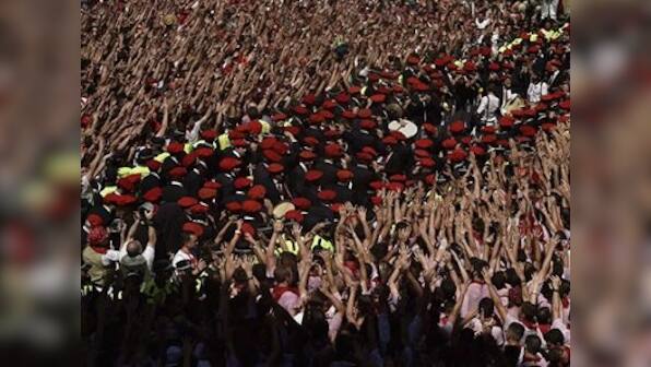 Spain's bull-running festival paints Pamplona red as animal rights activists protest