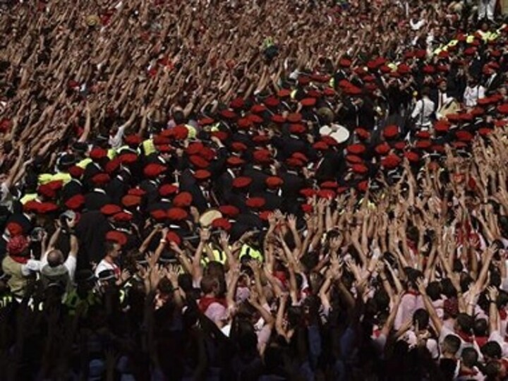 Spain's bull-running festival paints Pamplona red as animal rights activists protest