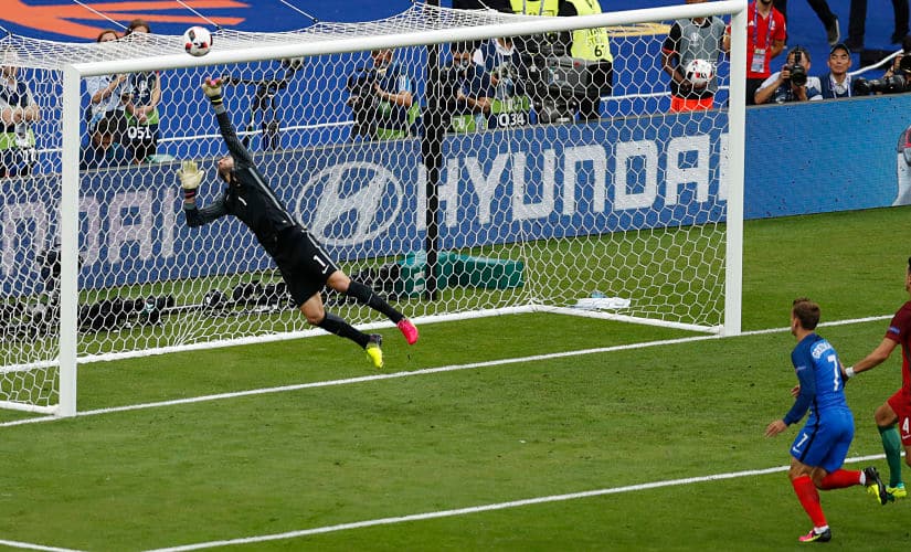Portugal goalkeeper Rui Patricio saves a header from the star of tournament Antonie Griezmann. AP