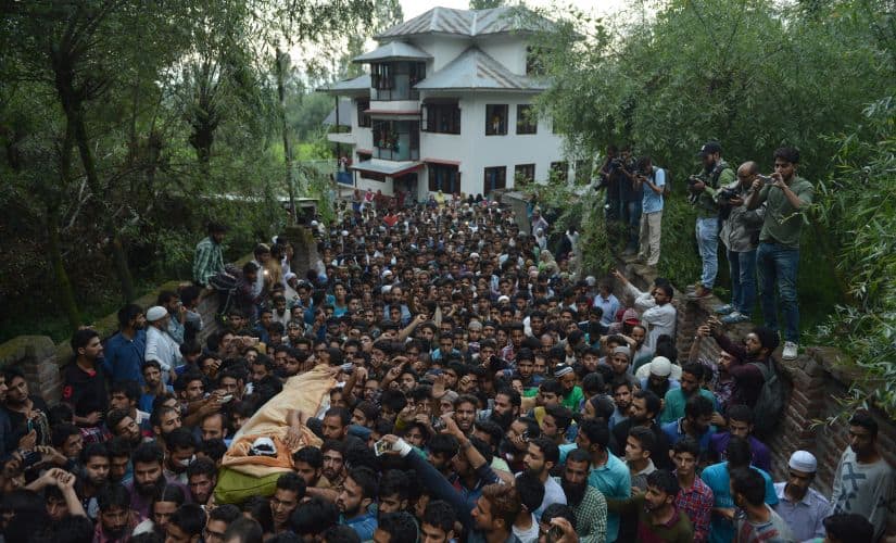 People thronged Burhan Wani's residence in Tral. AFP