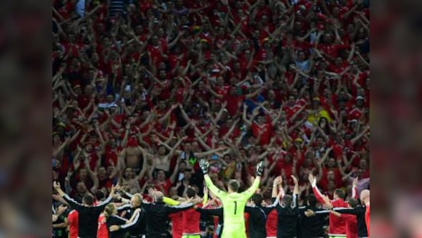 Gareth Bale-led Wales return to hero's welcome as 30,000 fans throng bus top parade