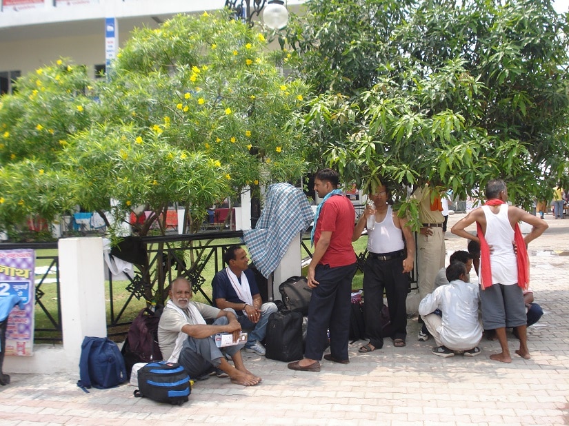 Pilgrims were willing to brave the sun after finding that the halls were packed to capacity. Ambika Choudhary