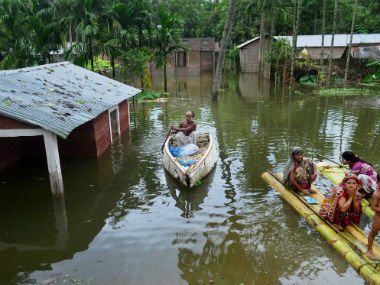 Assam floods: Flags hoisted in inundated school premises on 71st Independence Day Assam floods: Flags hoisted in inundated school premises on 71st Independence Day