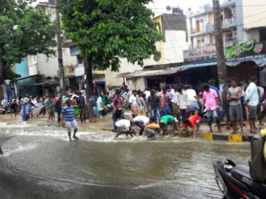 Bengaluru rains: People take to fishing on roads as flooded streets jam traffic Bengaluru rains: People take to fishing on roads as flooded streets jam traffic