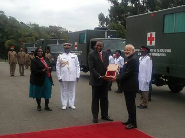 PM Narendra Modi hands over keys of 30 field ambulances to Kenyan President Uhuru Kenyatta. Twitter/ @MEAIndia 