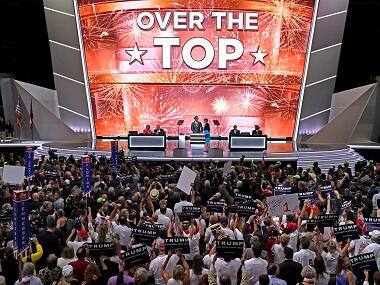 The large television monitor announces that after the New York delegation casts their votes that Donald Trump has enough votes to become the nominee of the Republican Party for President of the United States. AP